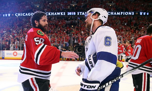 CHICAGO IL- JUNE 15 Corey Crawford #50 of the Chicago Blackhawks shakes hands with Anton Stralman #6 of the Tampa Bay Lightning after the Blackhawks won Game Six by a score of 2-0 to win the 2015 NHL Stanley Cup Final at the United Center on June 15