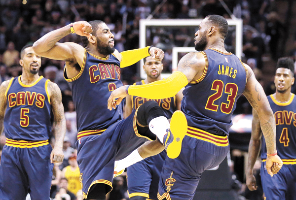 LeBron James right and Kyrie Irving celebrate a Cavaliers win over San Antonio in March