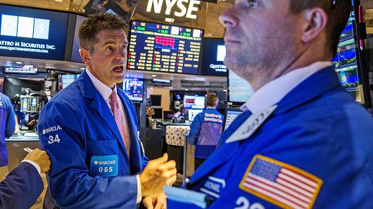 Traders work on the floor of the New York Stock Exchange