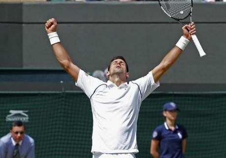 Novak Djokovic of Serbia celebrates after winning his match against Kevin Anderson of South Africa at the Wimbledon Tennis Championships in London