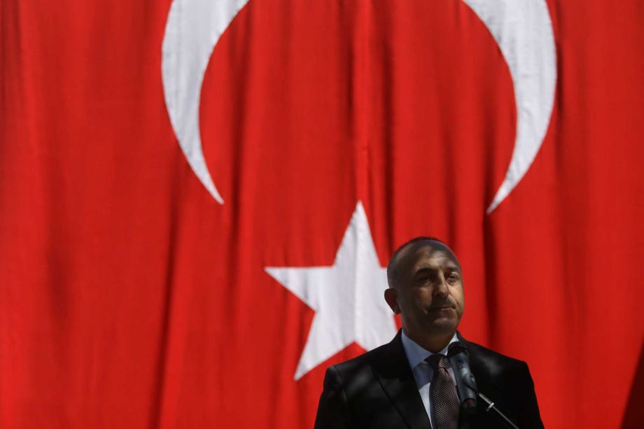 Turkish Foreign Minister Mevlut Cavusoglu delivers a speech during a ceremony in honour of the Portuguese policeman and a Turkish citizen who were victims of an attack on the Turkish embassy in Lisbon by an Armenian group in 1983 in Lisbon Monday July