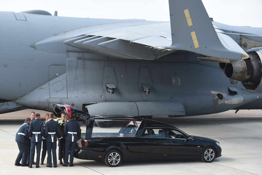 The coffin of Adrian Evans is taken from the RAF C-17