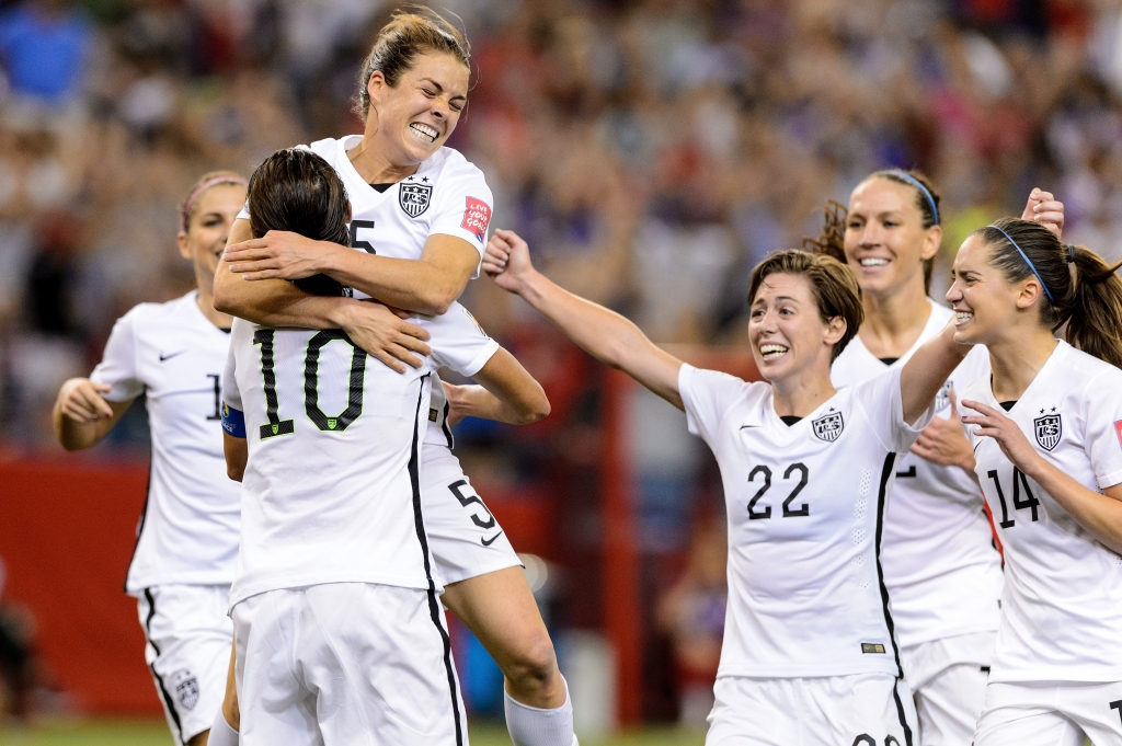 The women's soccer team celebrates after an earlier victory in June