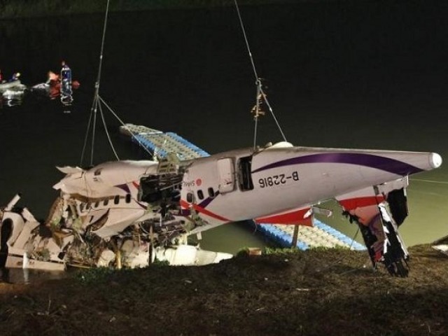 The wreckage of a Trans Asia Airways turboprop ATR 72-600 aircraft is recovered from a river in New Taipei City