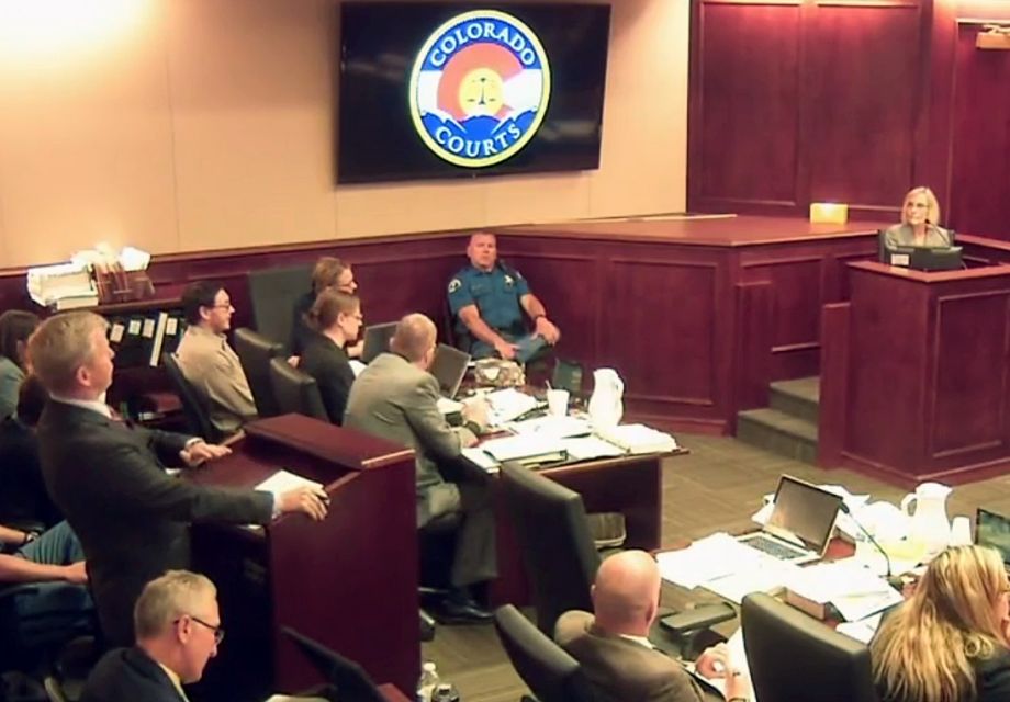 In this image taken from video accused Colorado theater shooter James Holmes second from left listens to testimony by Dr. Raquel Gur right during his trial in Centennial Colo. Monday