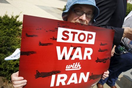 An activist holds a banner during an event of delivering more than 400,000 petition signatures to Capitol Hill in support of the Iran nuclear deal in Washingt