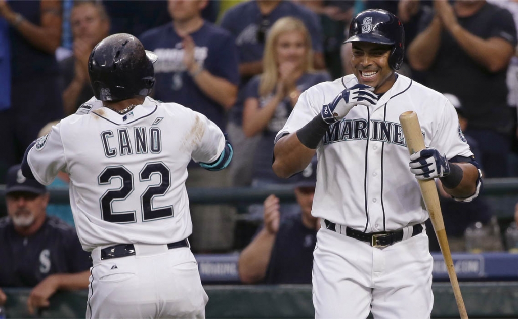 Seattle Mariners&#039 Nelson Cruz right celebrates with Robinson Cano after Cano hit a solo home run in the fifth inning of a baseball game against the Detroit Tigers Tuesday