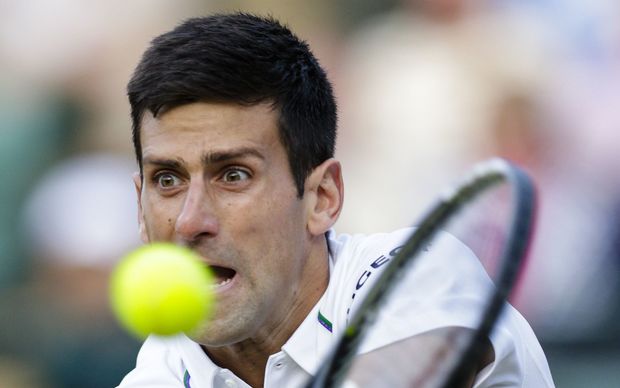 Top seed Novak Djokovic in action against 14th seed Kevin Anderson at Wimbledon 2015