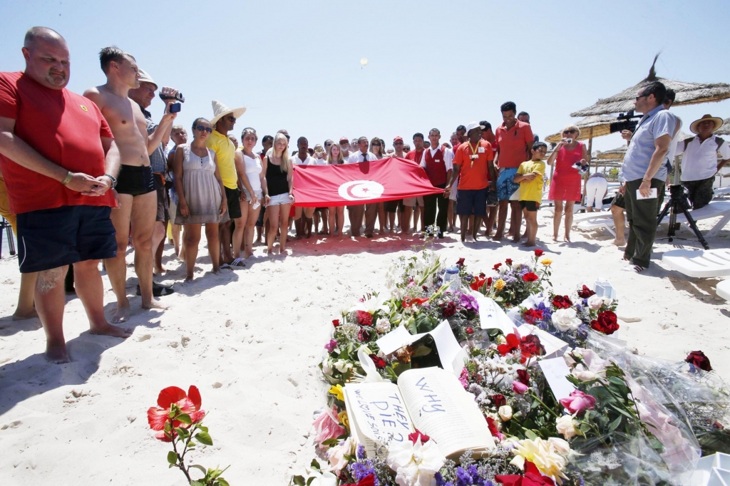 Tourists and staff remember the victims at the beach in Sousse