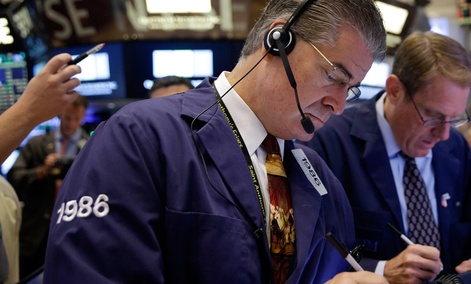 Trader Daniel Kryger works on the floor of the New York Stock Exchange Thursday