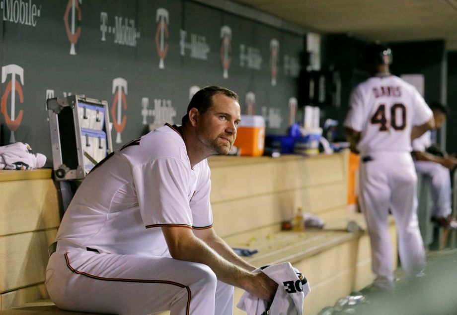 Minnesota Twins starting pitcher Mike Pelfrey sits in the dugout after being replaced by Blaine Boyer during the eighth inning of a baseball game against the Detroit Tigers in Minneapolis Thursday