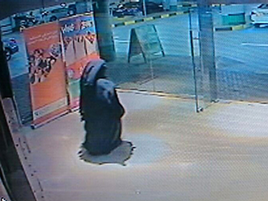 A veiled suspect in the stabbing of an American teacher in a shopping mall bathroom seen on security camera footage in Abu Dhabi