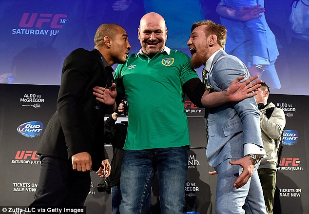 UFC president Dana White steps between the two fighters ahead of their proposed UFC 189 grudge match