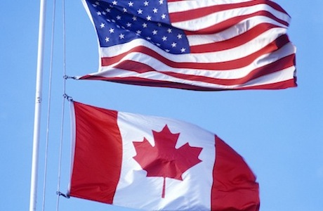 USA and Canadian Flags at the Canadian American border