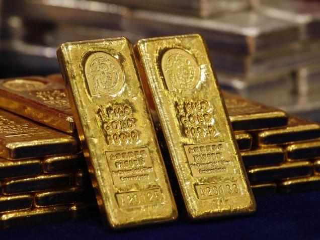 One-kg 24K gold bars are displayed at the Chinese Gold and Silver Exchange Society Hong Kong's major gold and silver exchange in this file