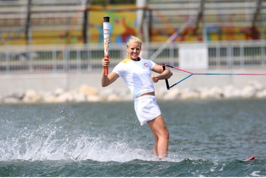 Whitney McClintock Pan Am multi-medallist and world champion at waterskiing carries the Pan Am flame. Pan Am waterskiing and wakeboarding start Monday