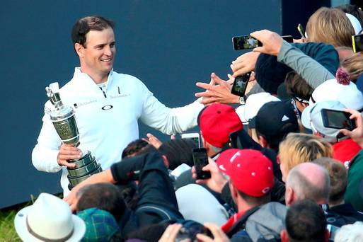 Well done Zach Johnson is congratulated after collecting the Claret Jug