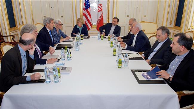 US Secretary of State John Kerry and his team sit across from the Iranian delegation headed by Foreign Minister Mohammad Javad Zarif during a session of nuclear talks