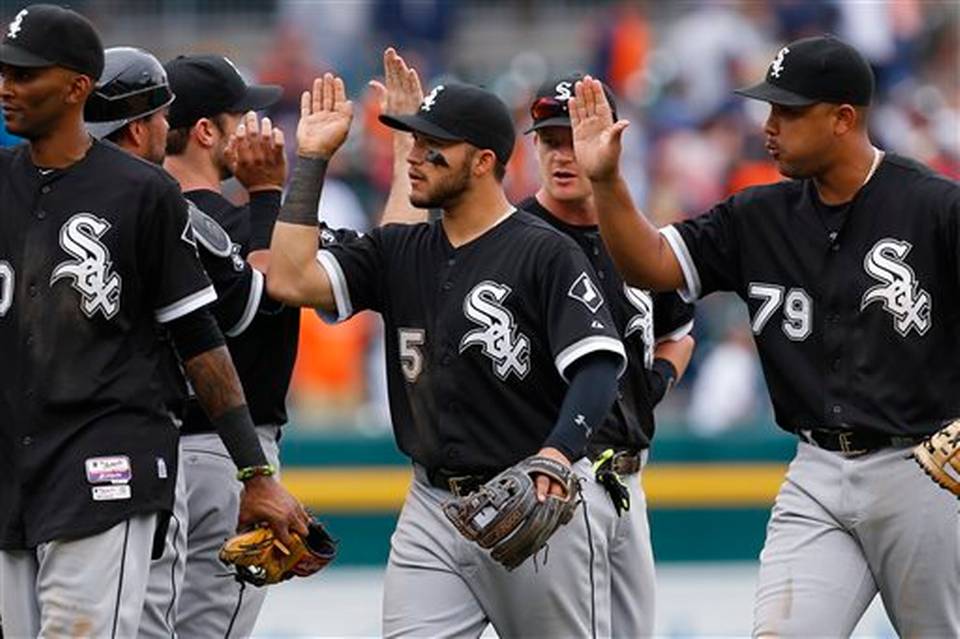 Chicago White Sox's Carlos Sanchez celebrates with teammates after their 8-7 win in 10 innings over the Detroit Tigers in a baseball game in Detroit Thursday