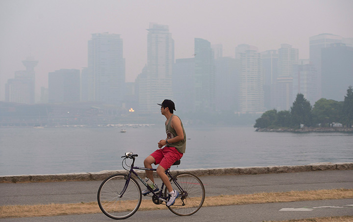 Smoke from wildfires in the interior of British Columbia blanket downtown Vancouver B.C. Sunday July 5 2015