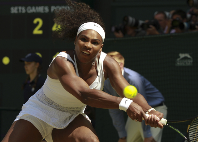 Serena Williams of the United States returns a shot to Garbine Muguruza of Spain during the women's singles final at the All England Lawn Tennis Championship