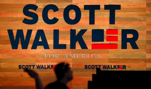 A worker sets up for the campaign kick-off rally for US Republican presidential candidate and Wisconsin Governor Scott Walker in Waukesha Wisconsin on Monday