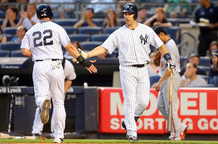 New York Yankees&#039 Jacoby Ellsbury greets Didi Gregorius after Gregorius scored on a double by Brendan Ryan during the sixth inning of a baseball game against the Baltimore Orioles Tuesday