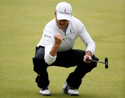 Zach Johnson reacts after making his birdie putt on the 18th green during the final round of the British Open golf championship on the Old Course in St. Andrews Scotland