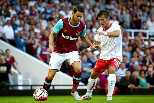 Matt Jarvis of West Ham tackles with Leo Maciel of FC Lusitans