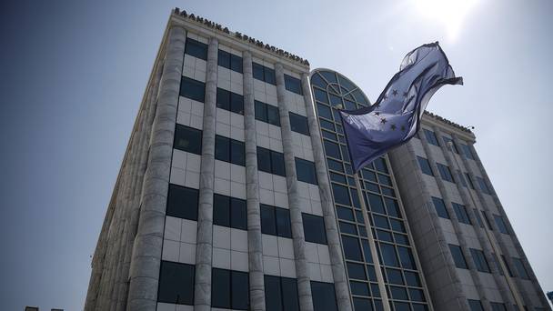 A European Union flag flutters outside the Athens stock exchange Greece