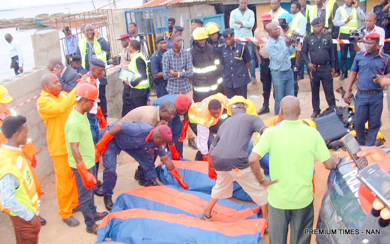 A Rescue Team with the Bodies of the Victims that were involved in the Helicopter crash