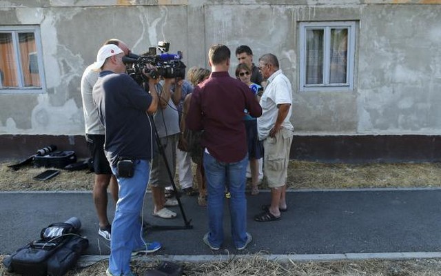 A family friend of Tomislav Salopek speaks to the media in Vrpolje village Croatia