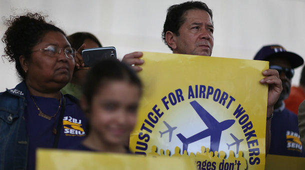 A group of airport workers rally for an increase in raises in Fort Lauderdale Florida