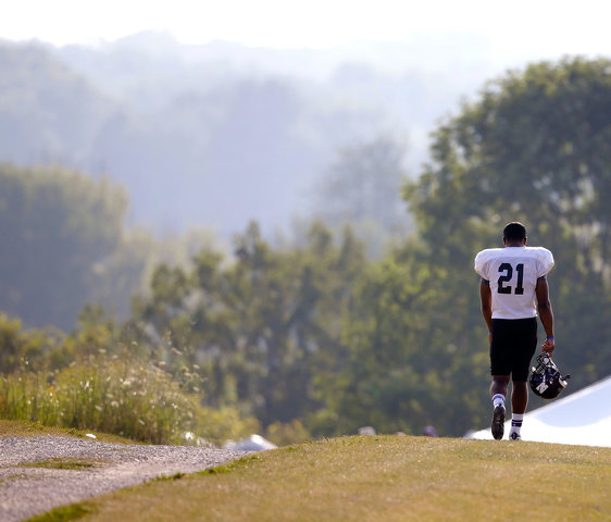 A northwestern football player walked to practice Monday on the Wisconsin Parkside campus. Click