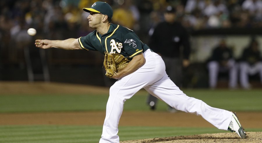 Oakland Athletics pitcher Pat Venditte works against the Los Angeles Dodgers in the seventh inning of a baseball game Tuesday Aug.18 2015 in Oakland Calif