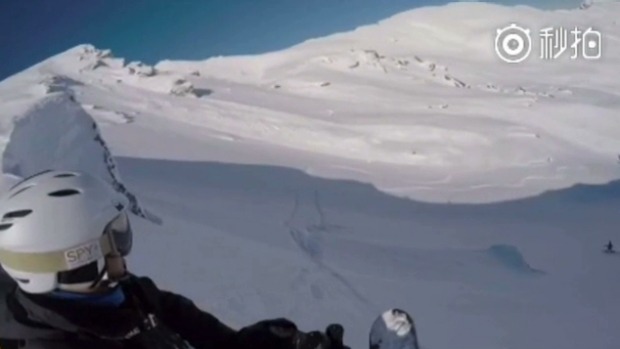 A screenshot shows the avalnche bearing down on the skier