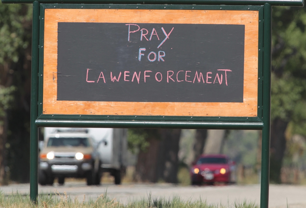 A sign sits next to Highway 178 in Weldon California near where police were searching for