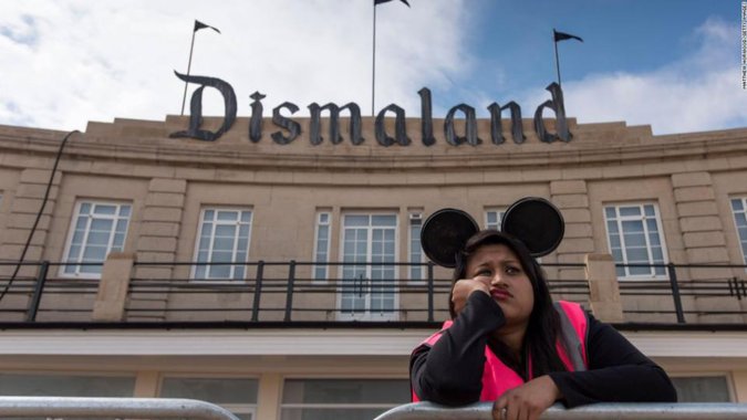 A steward at the gates of Dismaland