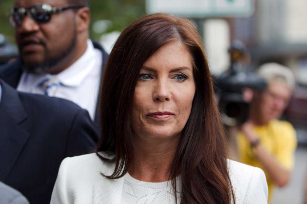 Pennsylvania Attorney General Kathleen Kane arrives to be processed and arraigned on charges she leaked secret grand jury material and then lied about it under oath at the Montgomery County detective bureau in Norr