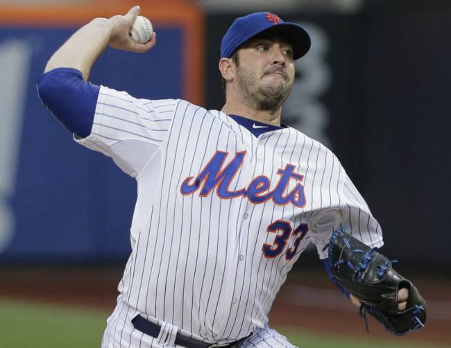 Mets pitcher Matt Harvey delivers against the Colorado Rockies during the first inning