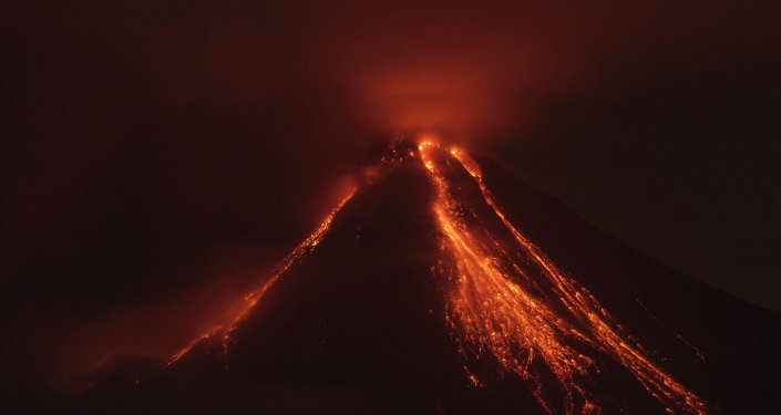 Lava flows down the banks of the Colima Volcano also known as the Volcano of Fire near the town of Comala Mexico Friday