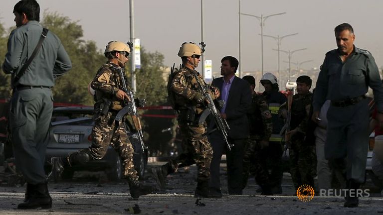 Afghan security personnel arrive at the site of a blast in Kabul Afghanistan