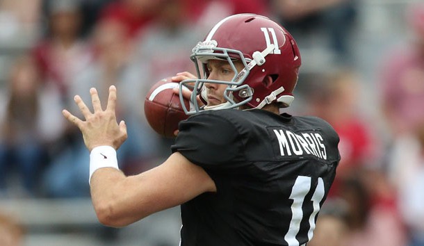 Alec Morris drops back to pass during the annual A-day game at Bryant Denny Stadium