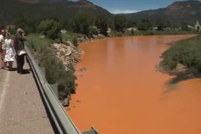 An estimated million gallons of mining waste has turned Colorado's Animas River a dark shade of orange