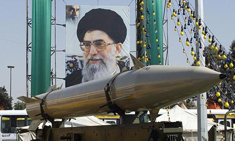 An image of Iran’s Supreme Leader Ali Khamenei looks down on a portion of his nation's arsenal