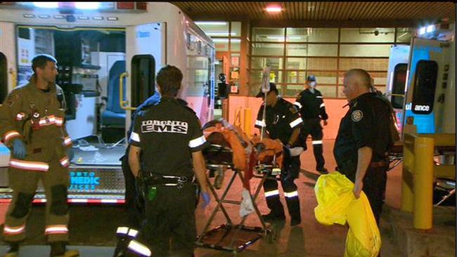 An injured person is being transported to a hospital after a shooting incident in Toronto Canada