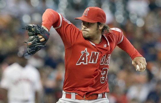 C.J. Wilson delivers a pitch against the Houston Astros in the first inning of a baseball game Tuesday