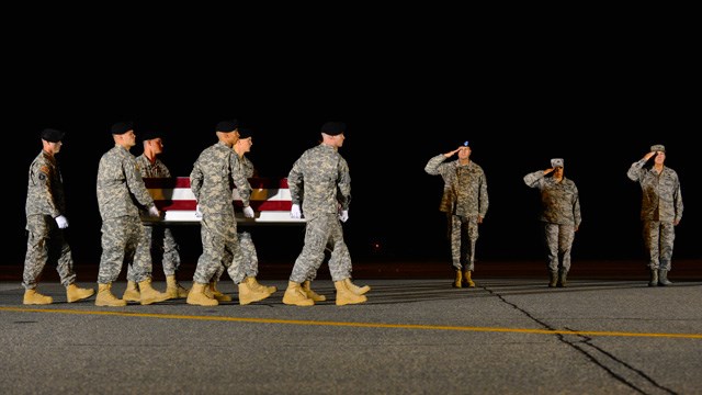 A U.S. Army carry team transfers the remains of 1st Sgt. Peter A. Mc Kenna Jr. of Bristol R.I. during a dignified transfer Aug. 10 2015 at Dover Air Force Base Del