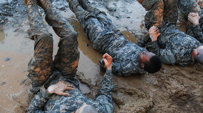 Army Soldiers participate in the Darby Queen obstacle course as part of their training at the Ranger Course on Ft Benning Ga