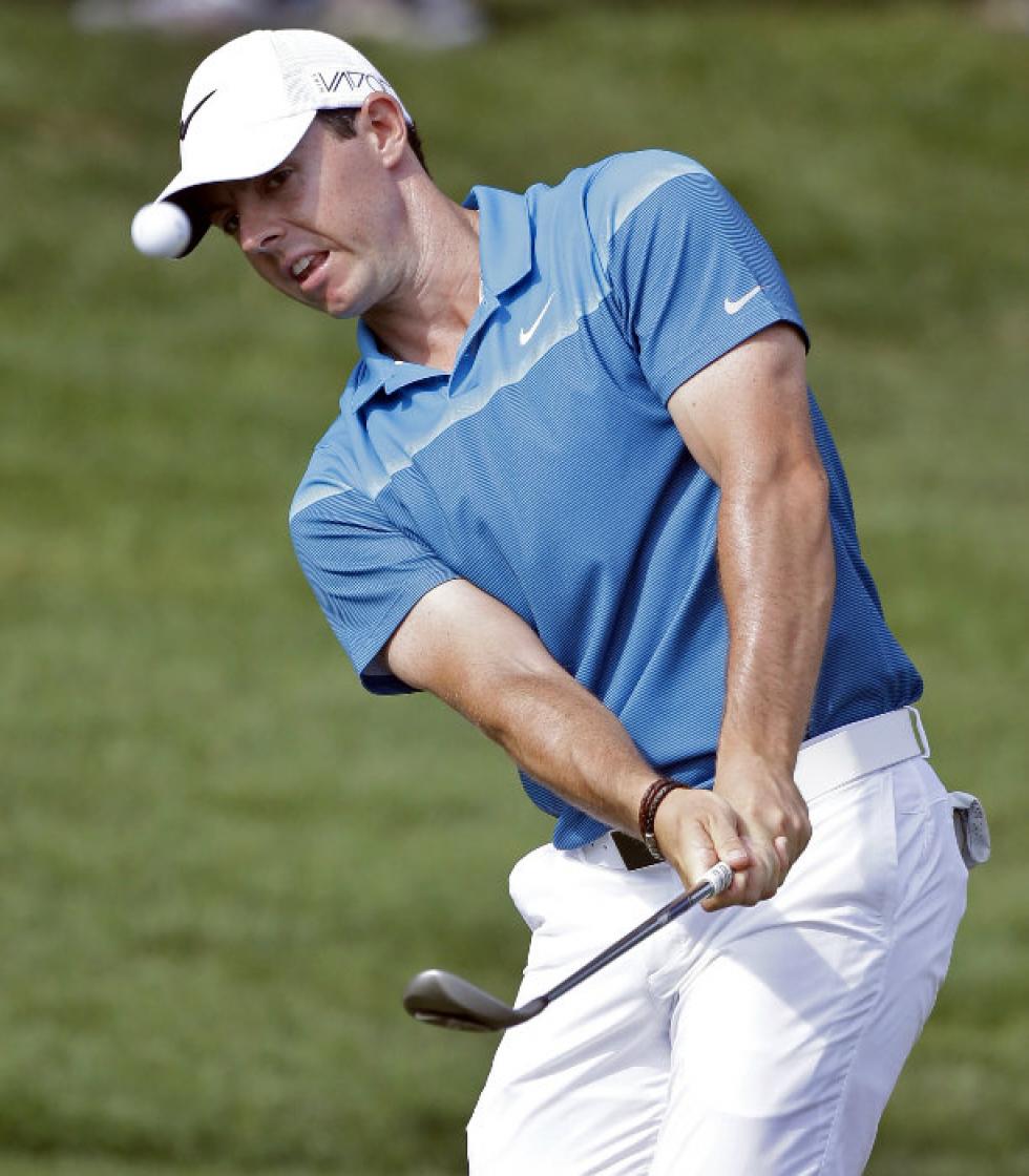 Associated Press
• Rory Mc Ilroy chips to the 15th green during the final round of the Wells Fargo Championship golf tournament May 17 at Quail Hollow Club in Charlotte N.C. World No. 1 Mc Ilroy looks to return from injury to defend his US PGA Champions